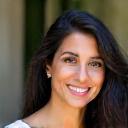 Professional portrait of Aisha Khan, Head of Community Outreach.